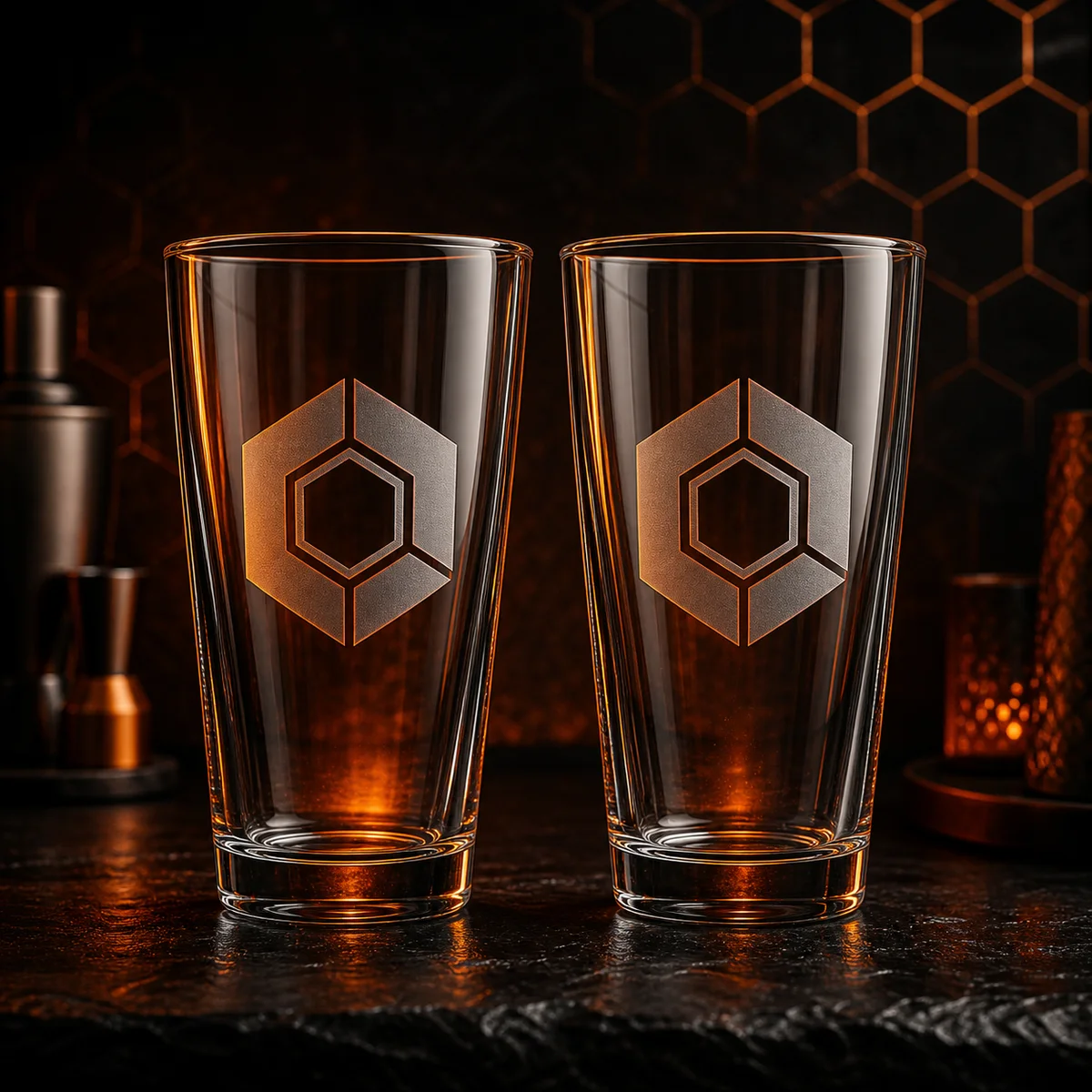 Two custom pint glasses with UV-printed emblem and ember backlight
